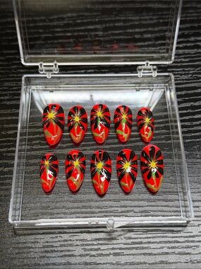Red Floral False Nail Set with Black & Yellow Starburst Design